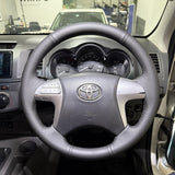 Toyota HiLux 7th Gen (2005–2015) Steering Wheel Wrap – Black Leather (smooth top, perforated sides), Black stitch