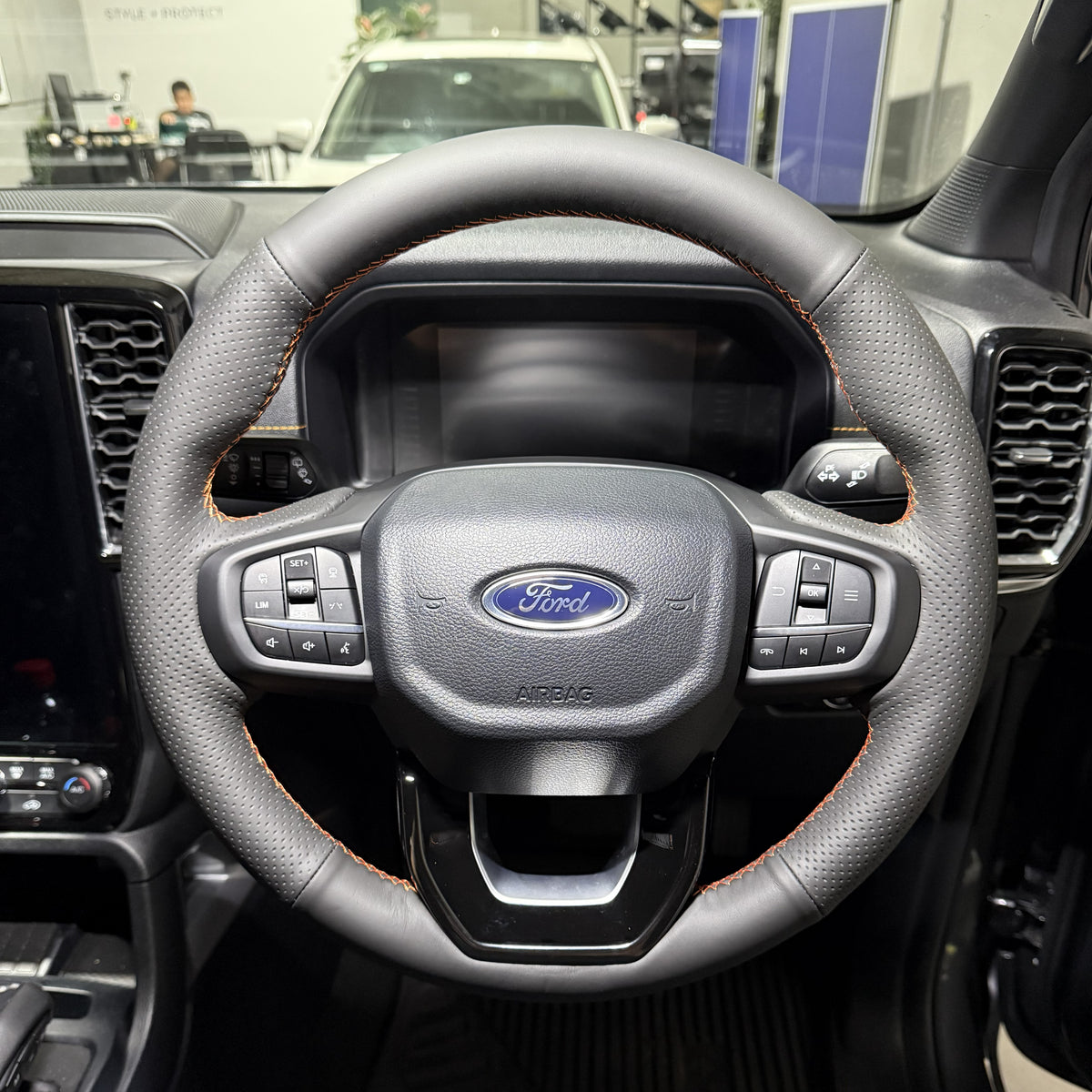 Ford Ranger / Everest Next-Gen (2022+) Steering Wheel Wrap – Black Leather (smooth top, perforated sides), Orange stitch