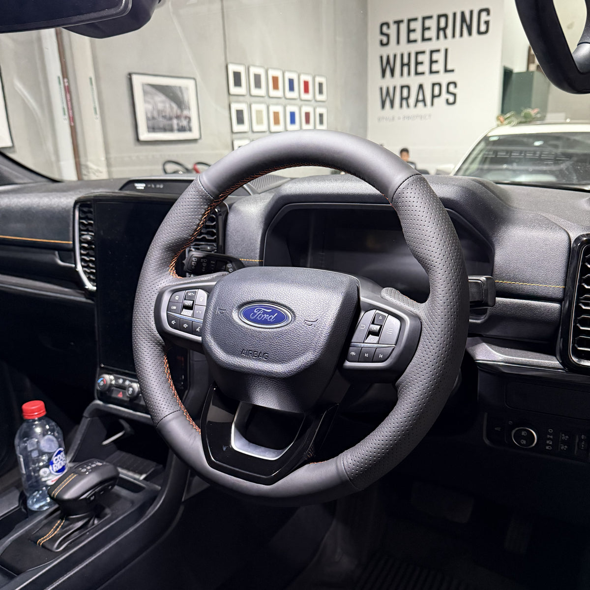 Ford Ranger / Everest Next-Gen (2022+) Steering Wheel Wrap – Black Leather (smooth top, perforated sides), Orange stitch