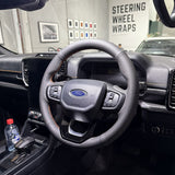 Ford Ranger / Everest Next-Gen (2022+) Steering Wheel Wrap – Black Leather (smooth top, perforated sides), Orange stitch