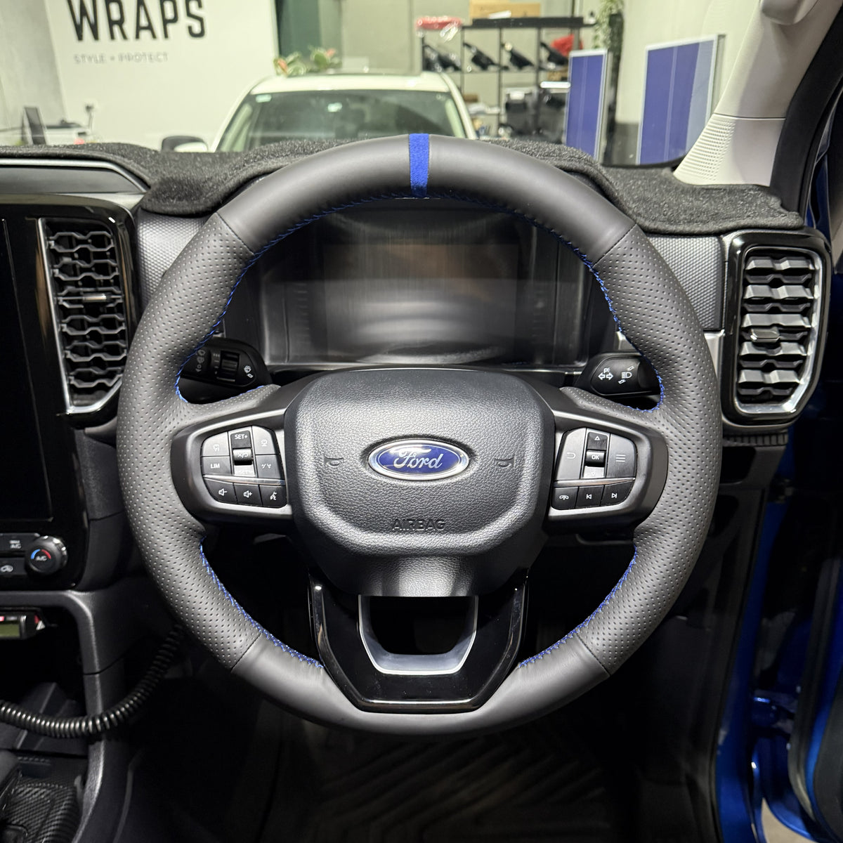 Ford Ranger / Everest Next-Gen (2022+) Steering Wheel Wrap – Black Leather (smooth top, perforated sides), Blue stitch, Blue Alcantara marker