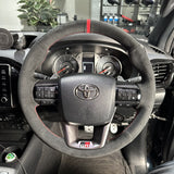 Toyota HiLux 8th Gen Steering Wheel Wrap – Black Alcantara, Red stitch, Red Alcantara Marker