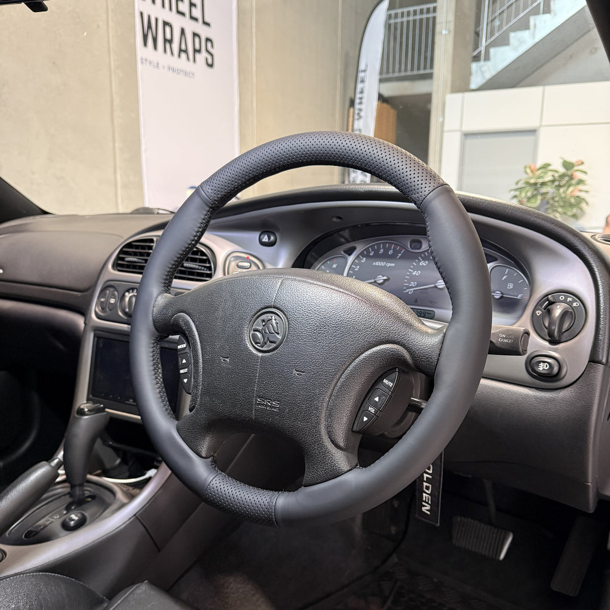 Holden Commodore VX/VT Series Steering Wheel Wrap – Black Leather (perforated top, smooth sides), Black stitch