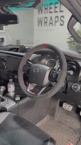 Toyota HiLux 8th Gen Steering Wheel Wrap – Black Alcantara, Red stitch, Red Alcantara Marker